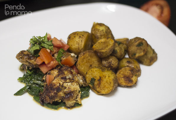 I served the chicken on top of the spinach, topped with chopped tomatoes and fresh basil, and the potatoes on the side