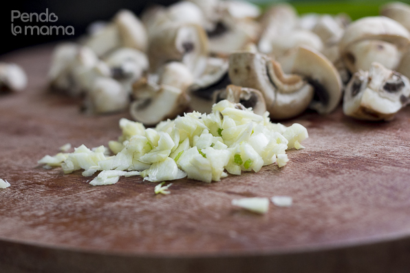 chop some garlic cloves and quarter some button mushrooms