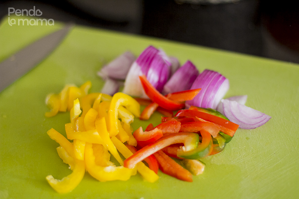 slices of onion, and red and yellow peppers